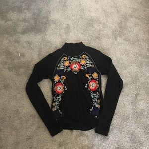 Floral embroidered turtle neck sweater